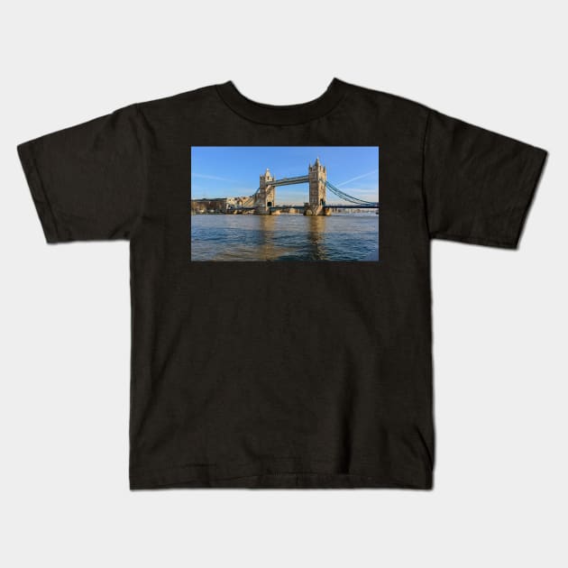 Tower Bridge against blue sky Kids T-Shirt by lena-maximova